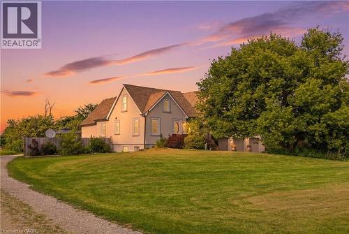 Expansive green lawn bordering a gravel drive - 97 Smith Road, Hamilton, ON 