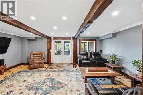 Exposed wood beams accenting the ceiling and wall supports - 97 Smith Road, Hamilton, ON 