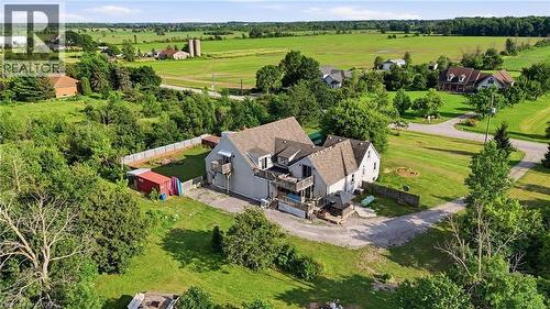 Expansive property with a multi-level structure featuring light grey siding and a brown shingled roof - 97 Smith Road, Hamilton, ON 