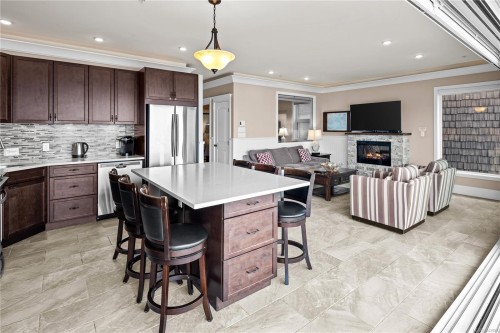 #42B-1000 Sookepoint Pl, Sooke, BC - Indoor Photo Showing Kitchen With Fireplace With Stainless Steel Kitchen With Upgraded Kitchen
