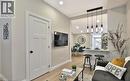 Open-concept living space with wood-finish flooring - 33 Hawthorne Avenue, Hamilton, ON 