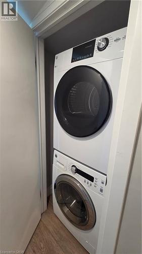 Stackable washer and dryer unit installed within a dedicated closet - 33 Hawthorne Avenue, Hamilton, ON 