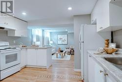 Large kitchen open to bright living room - 