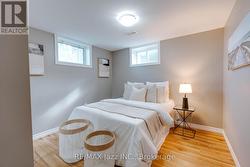 Lower primary bedroom with 2 windows and closet - 