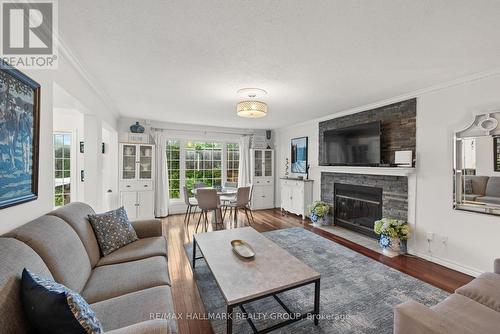 Family room with wood fireplace - 29 Depper Place, Ottawa, ON 