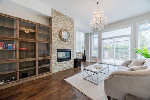 Salle familiale - 4110 Rue De Louviers, Brossard, QC - Indoor Photo Showing Living Room With Fireplace