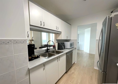 Kitchen - 504-15 Rue Des Émeraudes, Repentigny (Repentigny), QC - Indoor Photo Showing Kitchen With Double Sink