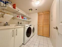 Ensuite laundry w/plenty storage - 