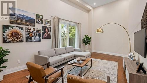 virtually staged iving room - 36 - 250 Bridletowne Circle, Toronto, ON - Indoor Photo Showing Other Room