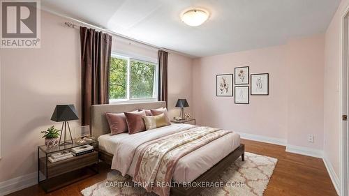 virtually staged primary bedroom - 36 - 250 Bridletowne Circle, Toronto, ON - Indoor Photo Showing Bedroom