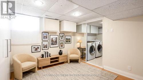 virtually staged  rec room - 36 - 250 Bridletowne Circle, Toronto, ON - Indoor Photo Showing Laundry Room