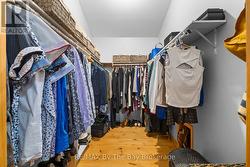 large walk in closet in master bedroom - 