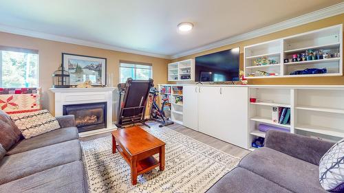112 11Th Street, Cranbrook, BC - Indoor Photo Showing Living Room With Fireplace