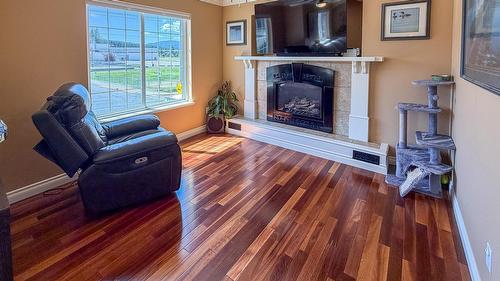 112 11Th Street, Cranbrook, BC - Indoor Photo Showing Living Room With Fireplace