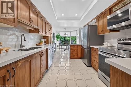 stainless steel appliances - 1237 North Shore Boulevard Unit# 405, Burlington, ON - Indoor Photo Showing Kitchen With Double Sink