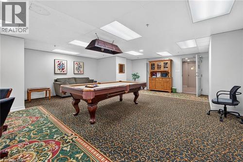 Recreational space featuring a billiards table with an overhead light fixture, recessed lighting, and patterned carpet flooring - 1237 North Shore Boulevard Unit# 405, Burlington, ON - Indoor Photo Showing Other Room