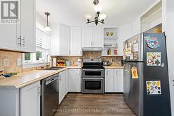 The kitchen is fresh and brightly decorated. - 