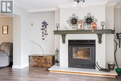 A fireplace with mantel is a nice feature. - 