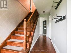 The wooden staircase to the second floor. - 