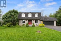 Featuring a distinctive mansard-style roofline - 