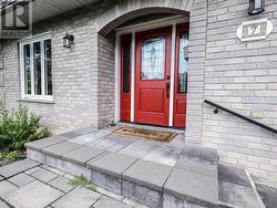 The impressive red door offers a pop of colour. - 