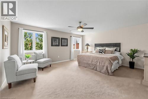 Spacious bedroom featuring light-colored carpet flooring and neutral wall tones - 729 Boughton Crescent, Milton, ON 