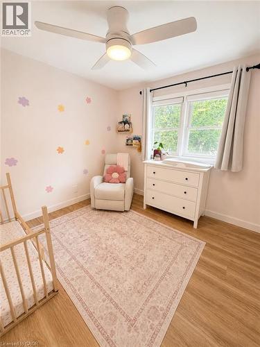 Room with wood-finish flooring and a white ceiling fan with integrated lighting - 355 East 36Th Street, Hamilton, ON 