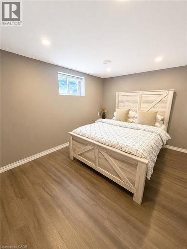 Wood-finish flooring complementing neutral wall tones - 355 East 36Th Street, Hamilton, ON 