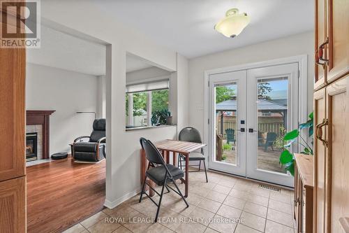 Patio doors in breakfast area lead to rear deck. - 70 College Circle, Ottawa, ON 