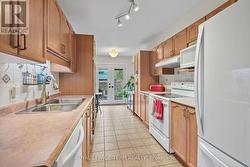 Ample natural light in Kitchen from patio doors. - 