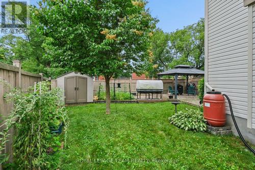 Fenced rear yard with shed. - 70 College Circle, Ottawa, ON 