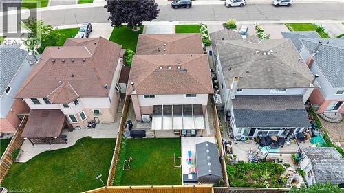 Aerial perspective of a detached residential property featuring a fenced backyard with a green lawn - 214 Merrilee Crescent, Hamilton, ON 