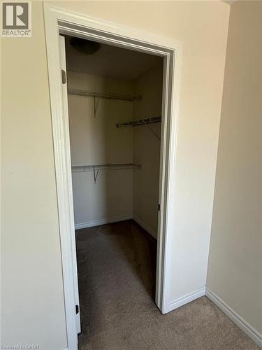 Walk-in closet featuring wire shelving, wall-to-wall carpeting, and baseboard trim - 63 Ridge Road Unit# Upper, Cambridge, ON 