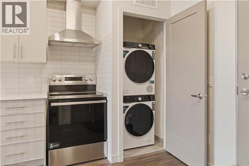 Kitchen area featuring a stainless steel range and coordinating exhaust hood - 1055 Weber Street E Unit# 207, Kitchener, ON 
