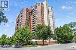 High-rise building with a brick facade and private balconies - 