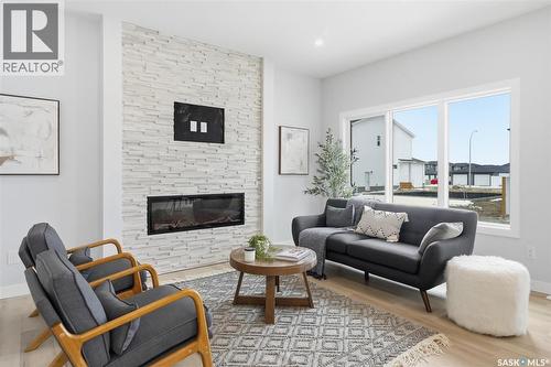 277 Lakeside Boulevard, Martensville, SK - Indoor Photo Showing Living Room With Fireplace