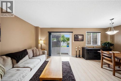 Open-concept living space featuring light wood-finish flooring throughout - 16 Scottacres Boulevard, Caledonia, ON - Indoor Photo Showing Living Room