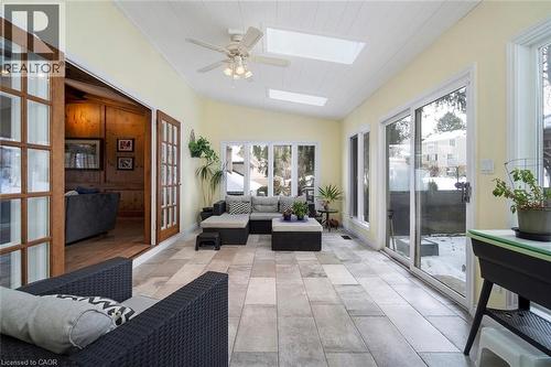 Sun room with natural light and access to backyard patio - 18 Stonegate Drive, Hamilton, ON 