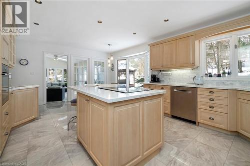 Kitchen view toward sunroom and family room - 18 Stonegate Drive, Hamilton, ON 