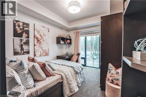 Room featuring a full-light glass door, textile flooring, and recessed ceiling details - 1235 Richmond Street Unit# 1406, London, ON 