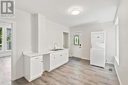 Main floor kitchen. Entrance. Main floor bathroom. - 