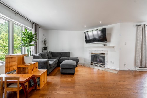 Salon - 1538 Rue De Gascogne, Laval (Chomedey), QC - Indoor Photo Showing Living Room With Fireplace