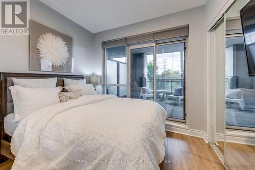 Bedroom opens on the Terrasse - 203 - 16 Brookers Lane, Toronto, ON - Indoor Photo Showing Bedroom