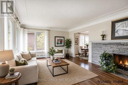 living room - 24 Tennessee Avenue, Port Colborne (Sugarloaf), ON - Indoor Photo Showing Living Room With Fireplace