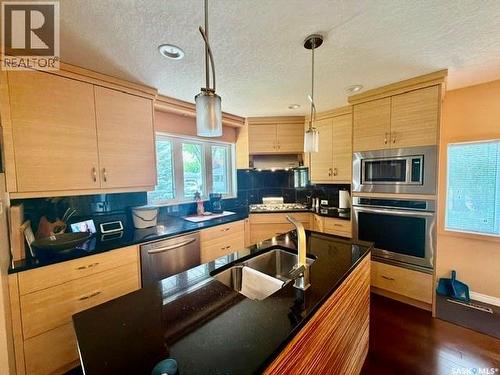 3307/3309 Dawson Crescent, Regina, SK - Indoor Photo Showing Kitchen With Double Sink