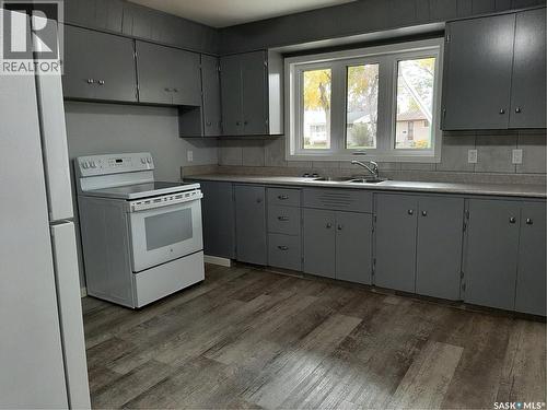 3307/3309 Dawson Crescent, Regina, SK - Indoor Photo Showing Kitchen With Double Sink