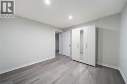 Light gray walls and wood-finish flooring - 