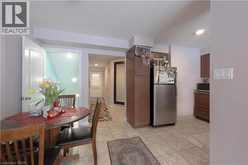 Kitchen featuring appliances with stainless steel finishes, light tile patterned floors, and recessed lighting - 535 Margaret Street Unit# 74, Cambridge, ON 