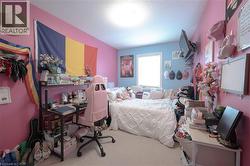 Carpeted bedroom featuring a textured ceiling - 