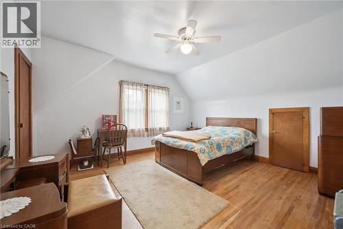 Room with hardwood flooring, a ceiling fan with light fixture, and a window with natural light - 75 Arnold Street, Kitchener, ON - Indoor Photo Showing Bedroom
